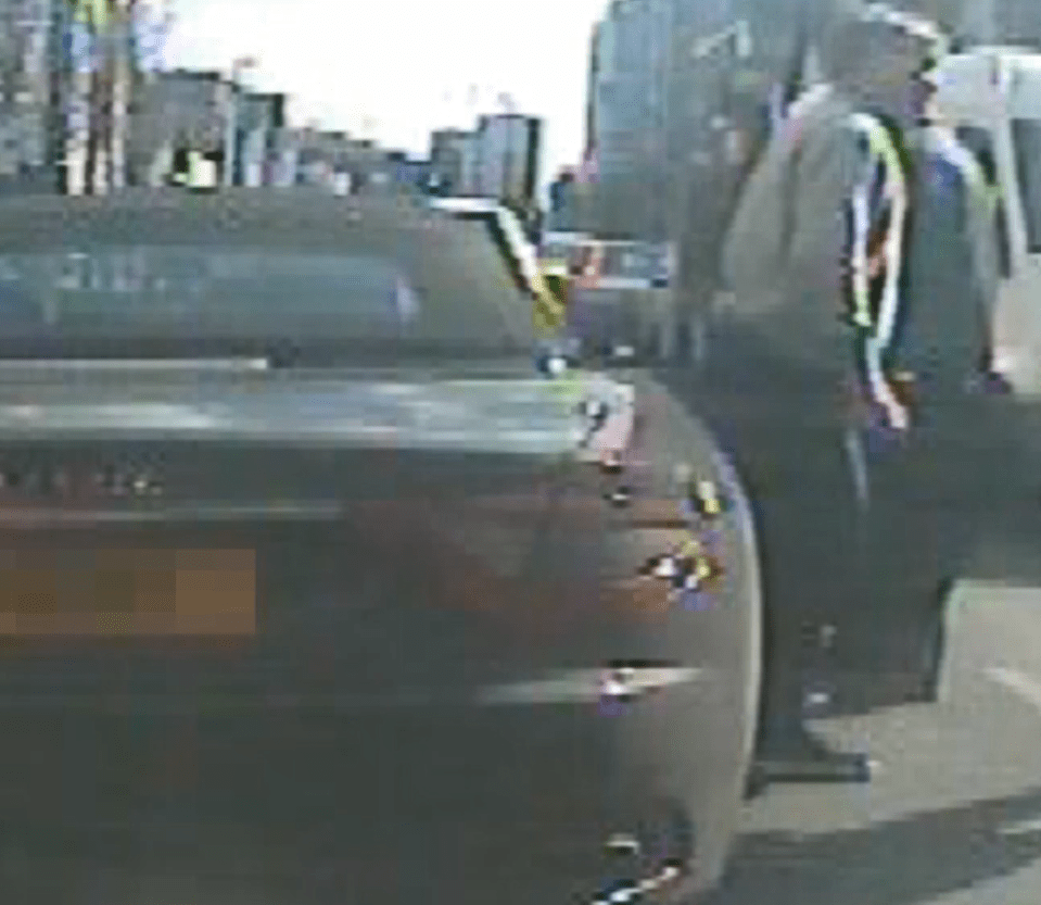  Mr Jordan exits his car to speak to worried onlookers on the busy high street