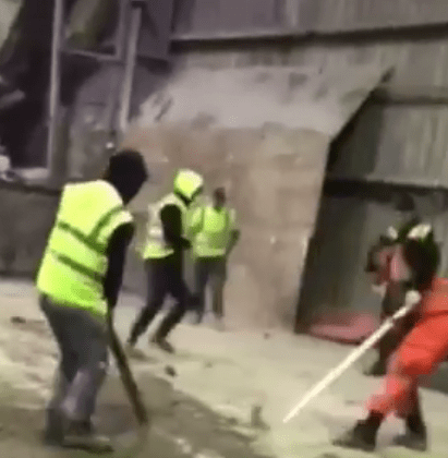  A sickening video has emerged of warehouse workers beating escaping rats to death with poles