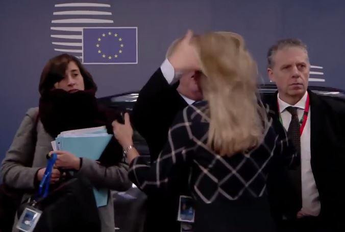  Jean-Claude Juncker then inappropriately flicks the woman's hair in Brussels