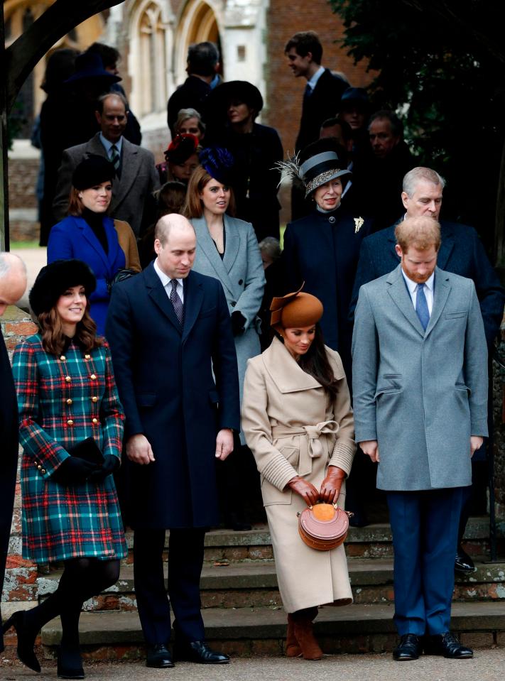  Meghan curtsies for the Queen in 2017 after service in Sandringham with Royal Family