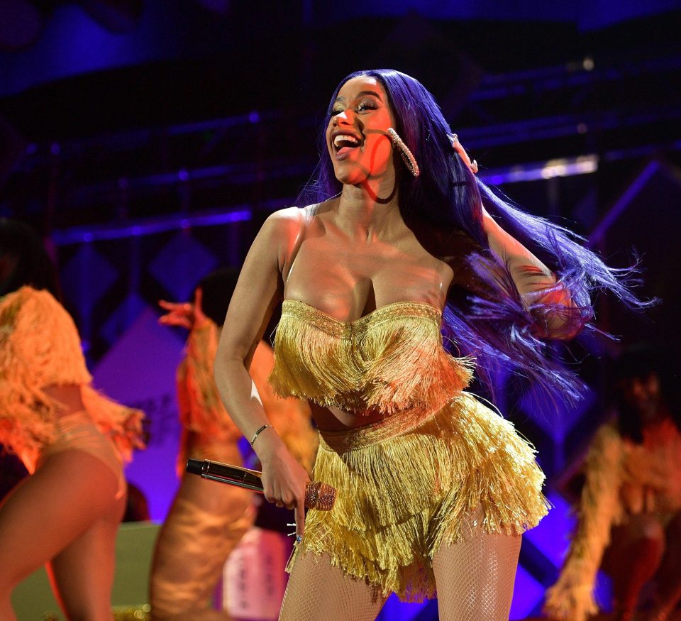  We wonder if Dua Lipa told Cardi B to rock some tassels for LA's Jingle Ball