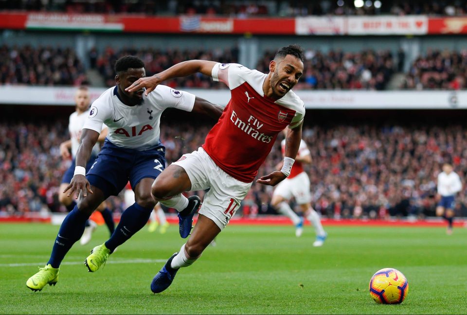  Arsenal striker Pierre-Emerick Aubameyang evades Spurs defender Serge Aurier