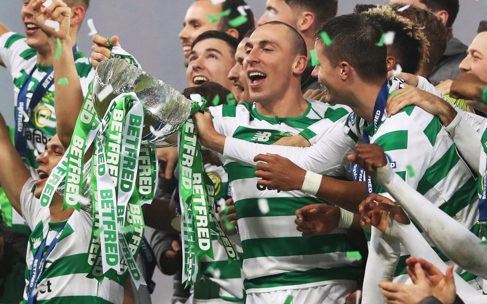  Celtic skipper Scott Brown lifts the Betfred Cup trophy at Hampden Park