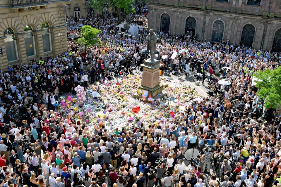  Members of the public observe a national minute's silence in remembrance of all those who lost their lives in the Manchester Arena attack