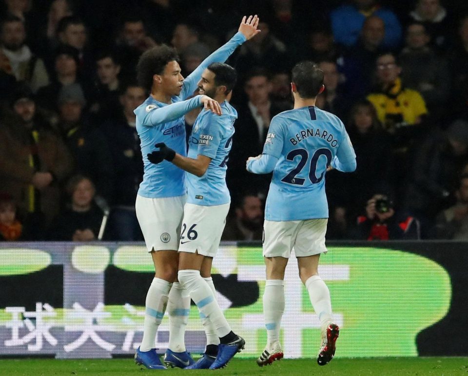  Leroy Sane celebrates with fellow scorer Riyad Mahrez and Bernardo Silva as City overcame Watford 2-1