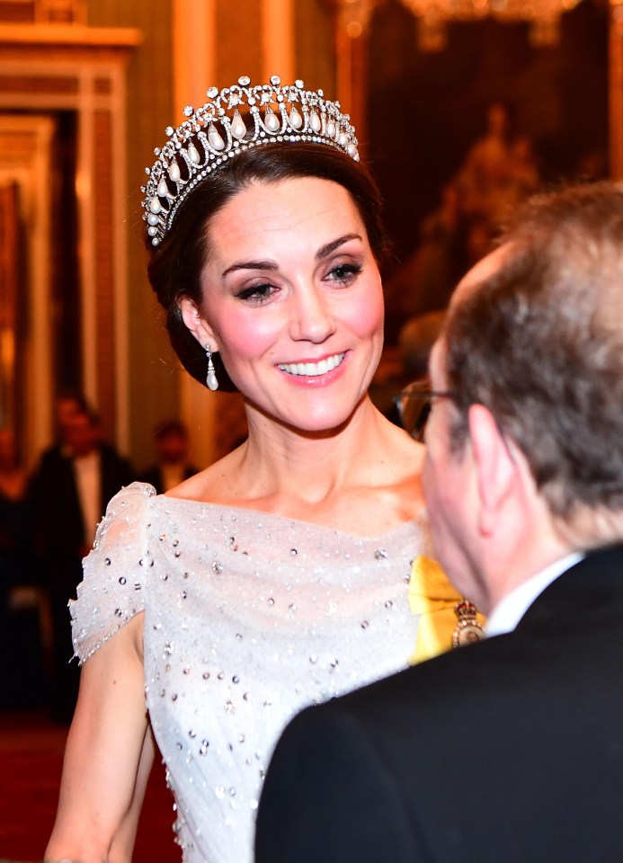 The Duchess of Cambridge meets with guests at an evening reception at Buckingham Palace 