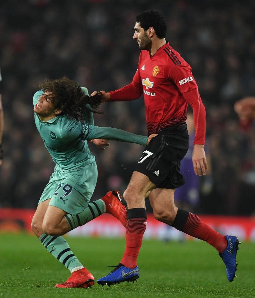  Marouane Fellaini hauled Matteo Geundouzi back by the hair