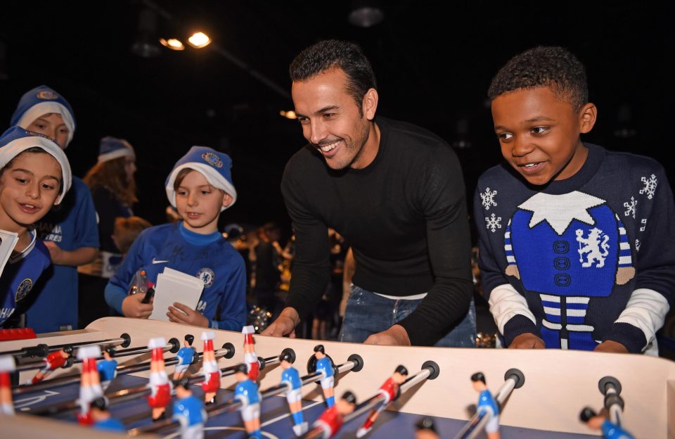  Pedro took time out to play some table football with the children