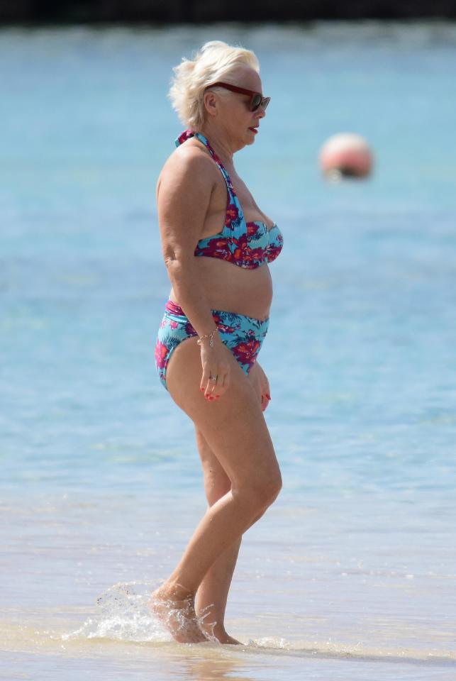  The 60-year-old star topped up her tan in a floral bikini