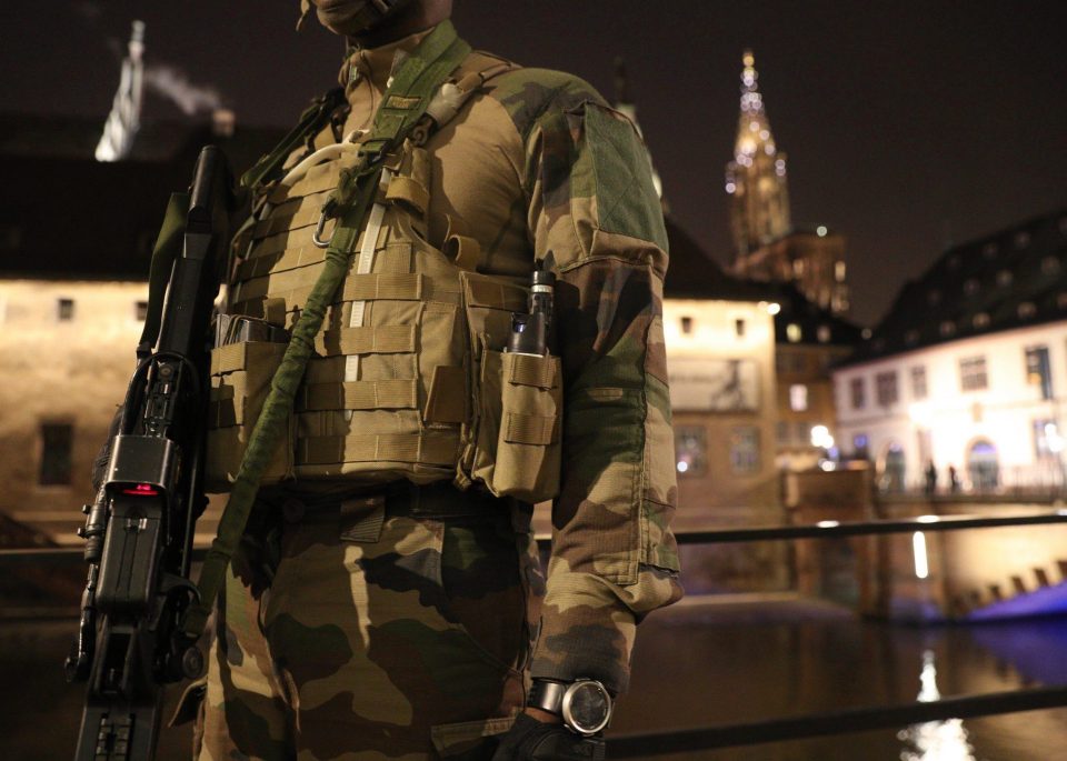  An armed soldier stands guard near Strasbourg Christmas market