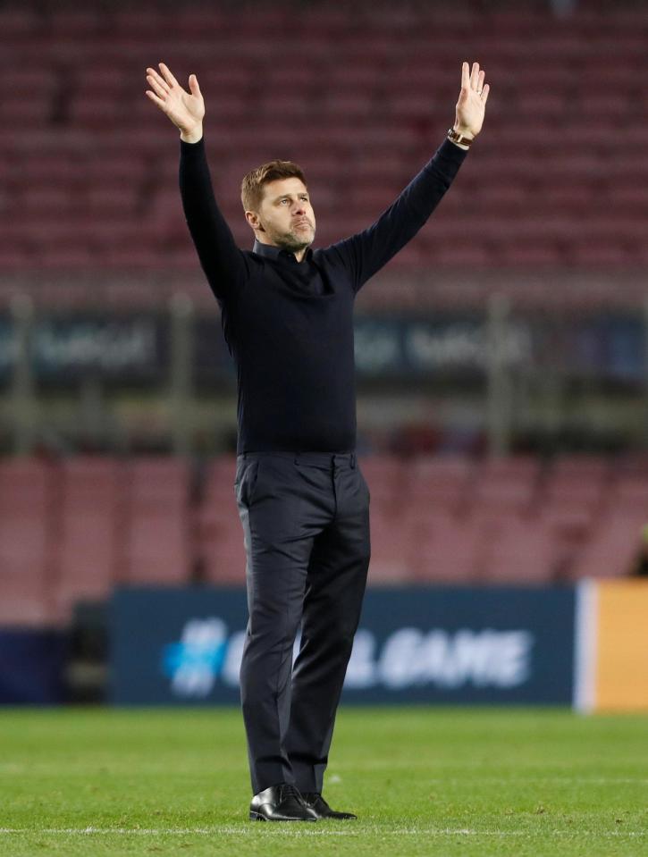  Pochettino applauds the travelling Tottenham supporters in the away end of the Nou Camp