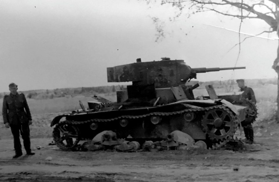  Soldiers inspect their damaged tank during the deadly battle