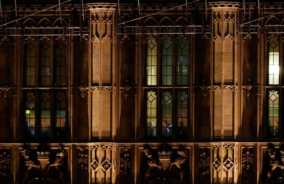  MPs listen to Theresa May speaking in a Commons committee room last night