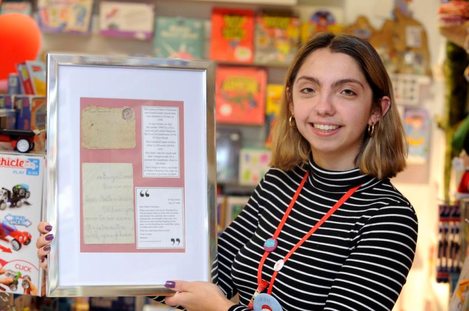  Lily Birchall, 19, holds Marjorie Pennington's letter to Santa from 120 years