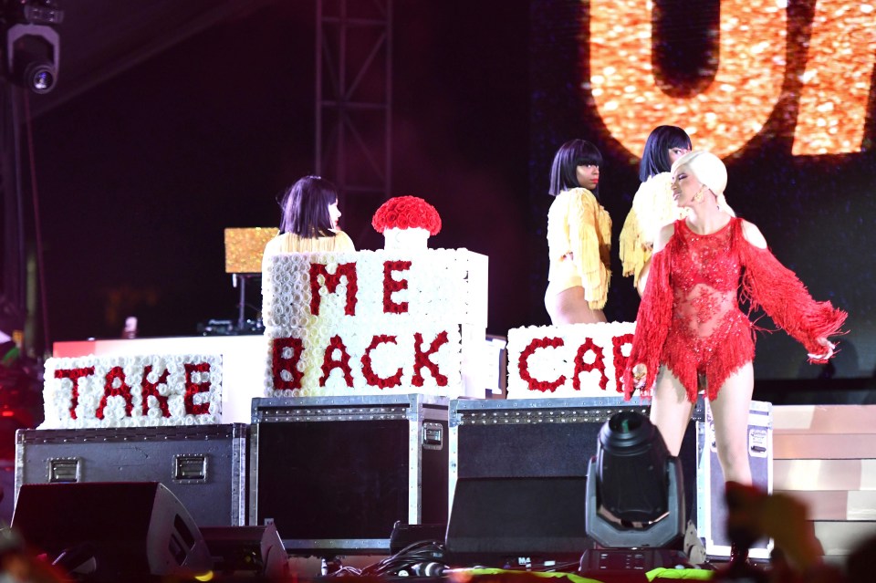 The rapper stormed the stage with a floral messages reading: ‘Take me back Cardi’