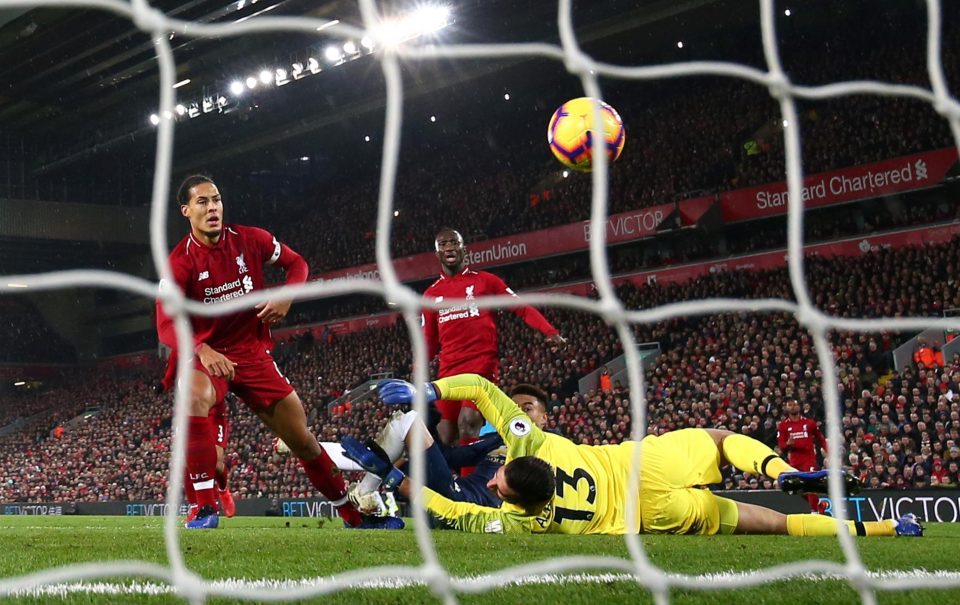  Liverpool defenders look on hopelessly as a shot from Jesse Lingard squirms in for a surprise leveller