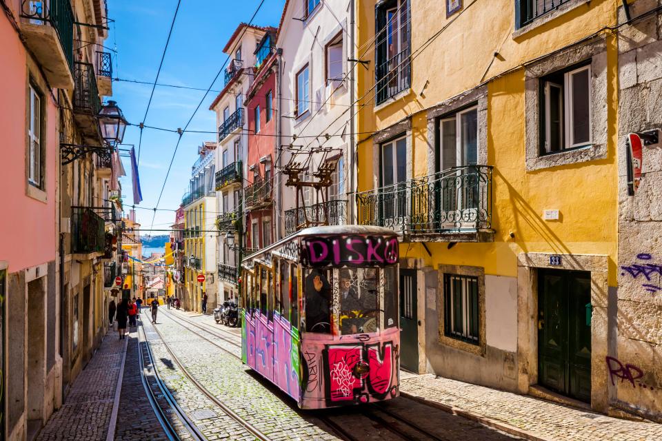  Ride the tram to explore the cultural and historical sights of Lisbon, Portugal - a top city break destination