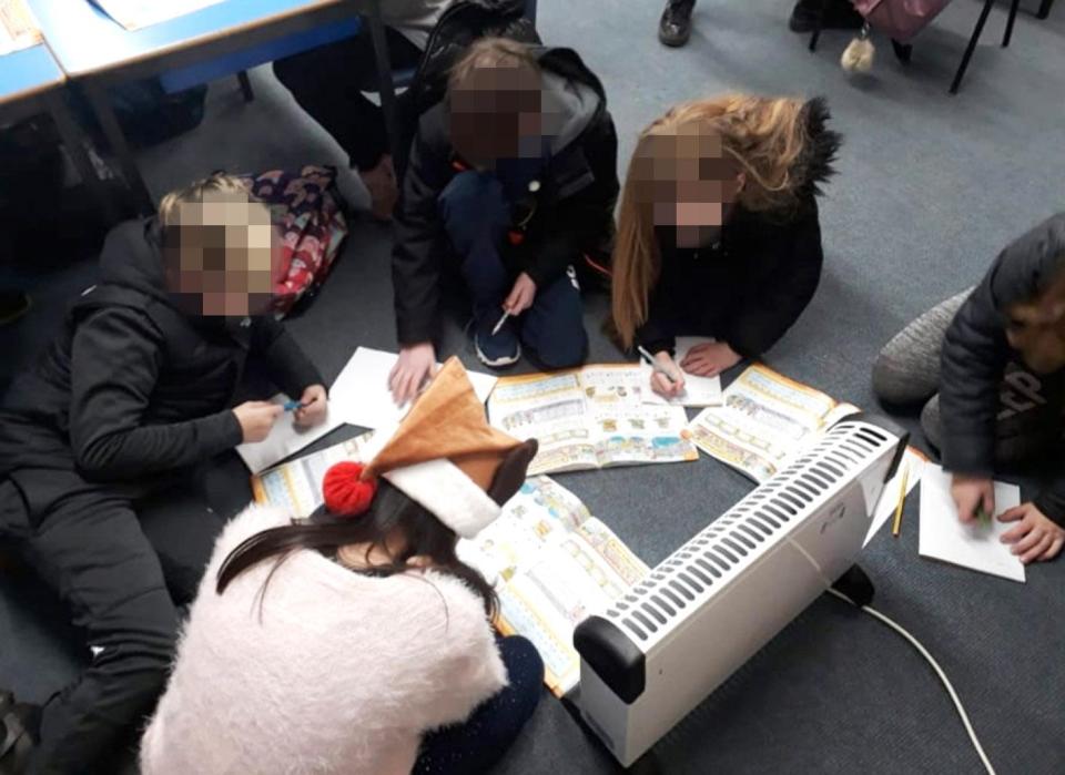  Pupils at a school in a posh Scottish suburb have been pictured wearing coats around an electric heater in makeshift classrooms