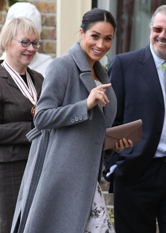  Meghan smiled and waved as she arrived