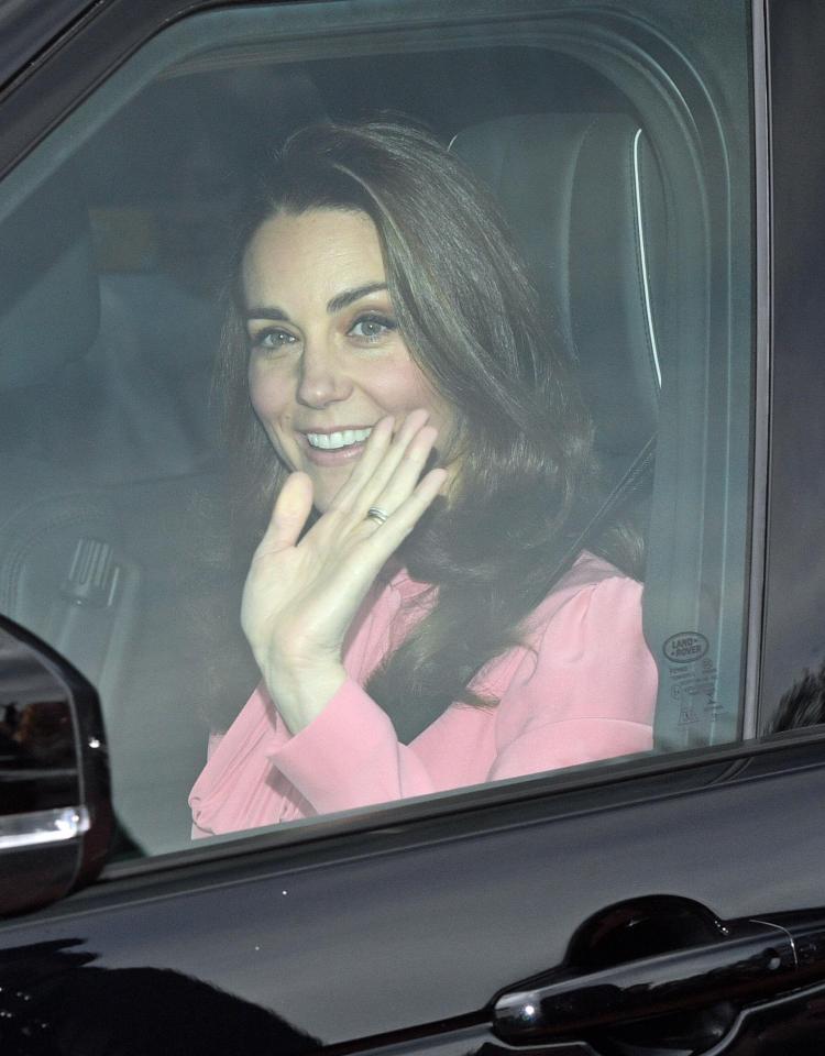  Kate looks stunning in pink, waving as she is driven inside by husband Prince William