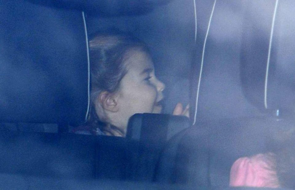  Princess Charlotte could be seen in the back of the car with parents Prince William and Kate