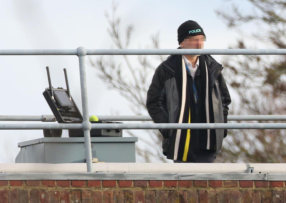  Cops use specialised frequency equipment to help find the drones on Gatwick Airport Police Station roof