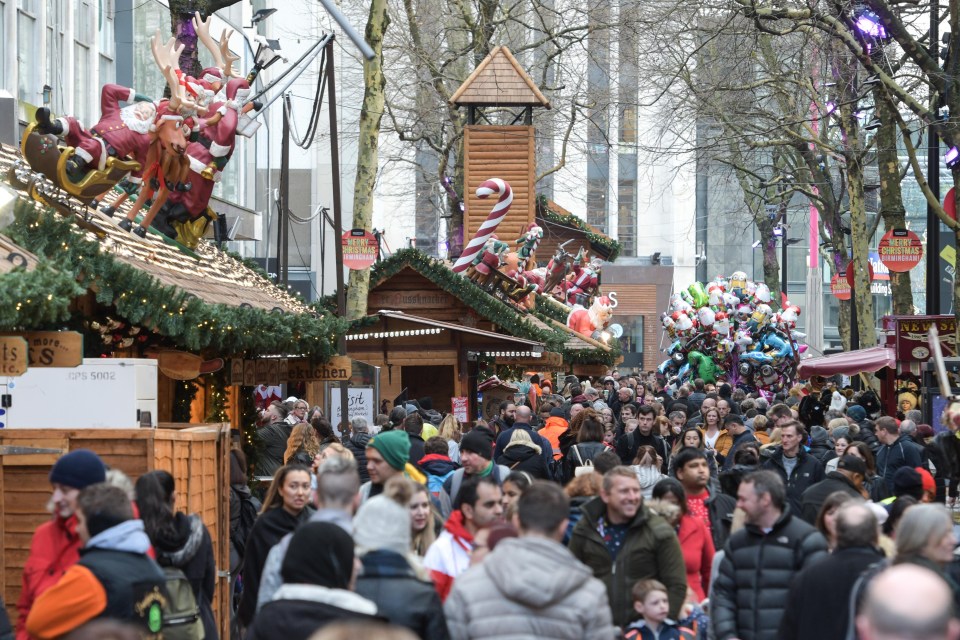 Thousands of shoppers flock to the Birmingham city centre to buy Christmas gifts