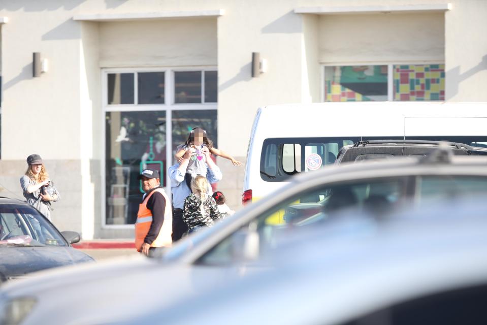  He was seen picking up youngsters as he volunteered for Christmas