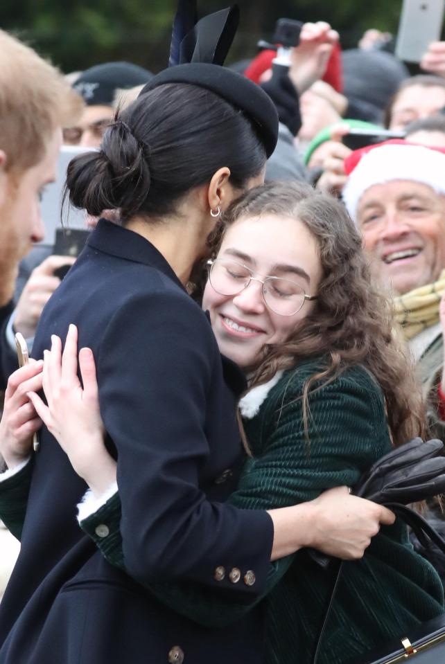  Meghan hugs a well-wisher at Sandringham today