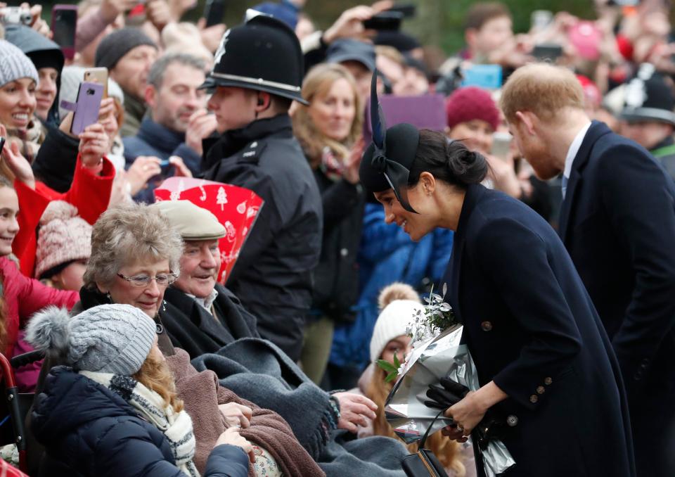  Meghan chats to people waiting in the crowds