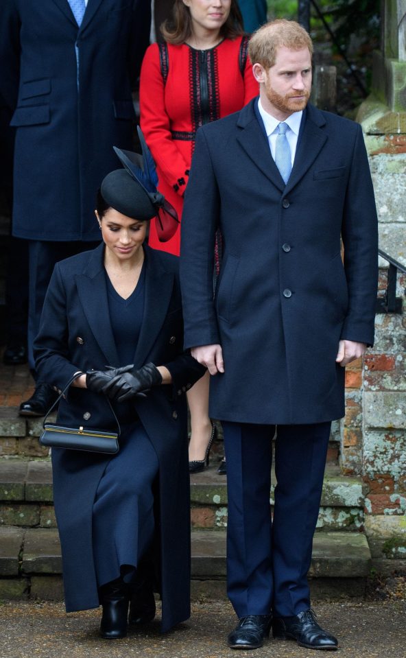  Meghan curtsies as the Queen leaves Sandringham