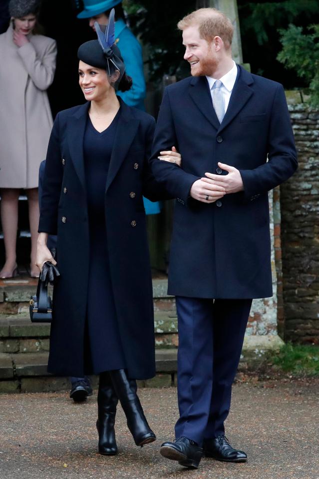  Meghan Markle clutches Prince Harry's arm as they leave church after Christmas Day service