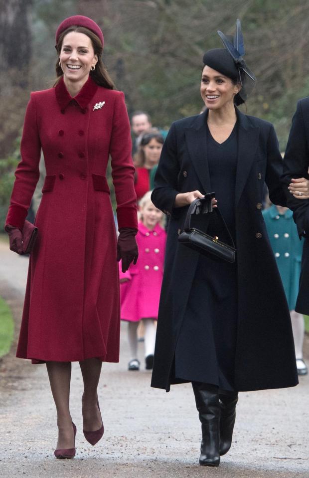  Meghan walks beside Kate Middleton on the way to church at Sandringham