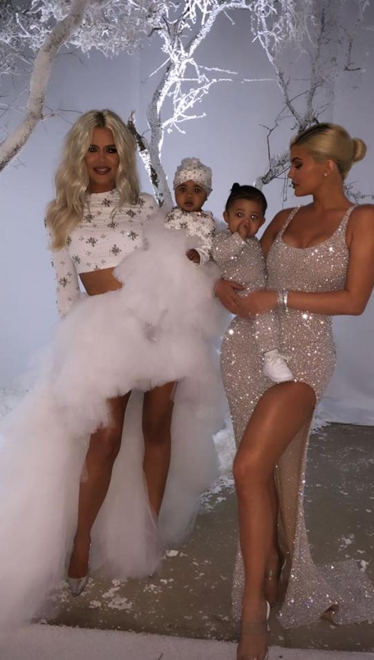  Khloe, here at the Kardashian's Christmas Eve party with her sister Kylie and her daughter Stormi