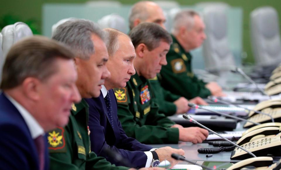  Mr Putin with generals at the missile command centre today