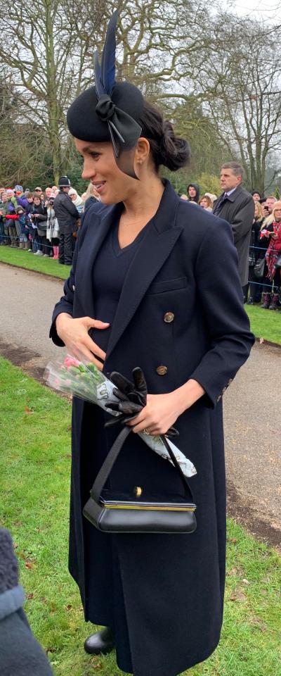  Amateur photographer Karen Anvil has managed to get another big-money shot of the royals - this time getting an adorable picture of Meghan Markle cradling her baby bump