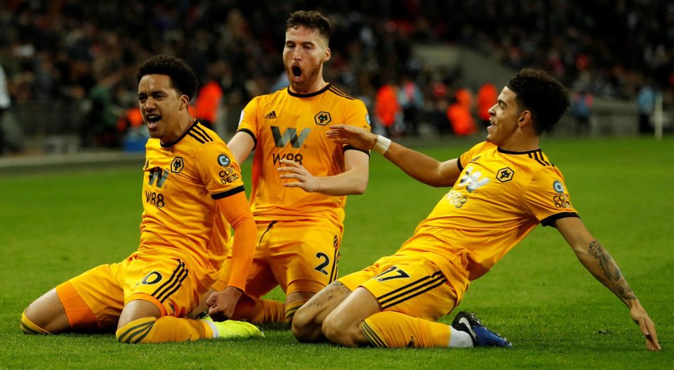  Helder Costa celebrates with Matt Doherty and Morgan Gibbs-White as Wolves seal their 3-1 win away to Spurs