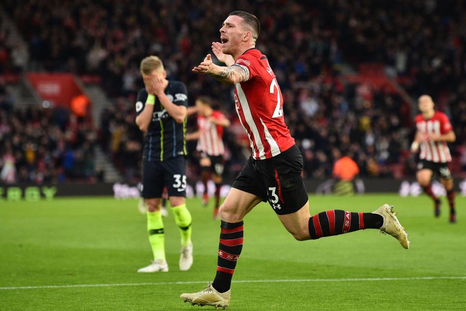  City's Oleksandr Zinchenko (L) reacts as Pierre-Emile Hojbjerg celebrates equalising for Southampton