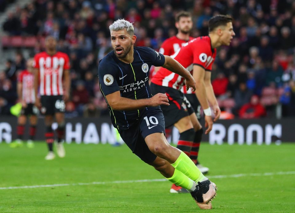  Aguero wheels away to celebrate City's third goal