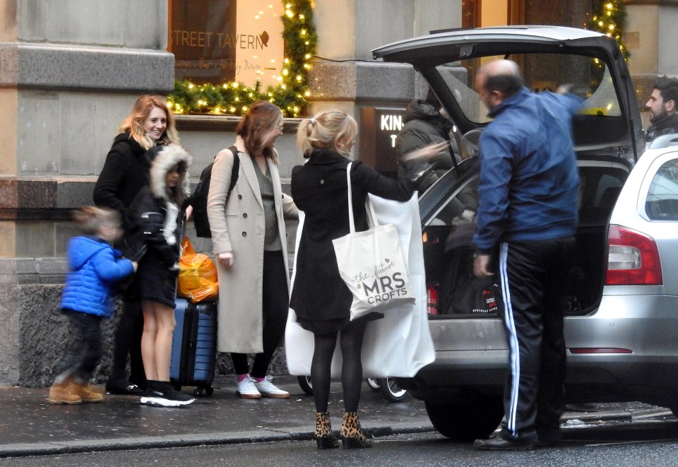 Tina O’Brien carried a ‘Mrs Crofts’ bag as she arrived at a Manchester hotel to marry her fiancé Adam Crofts today