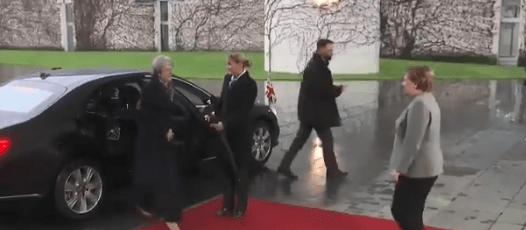  Eventually Mrs May was able to get out of the car and meet the German Chancellor