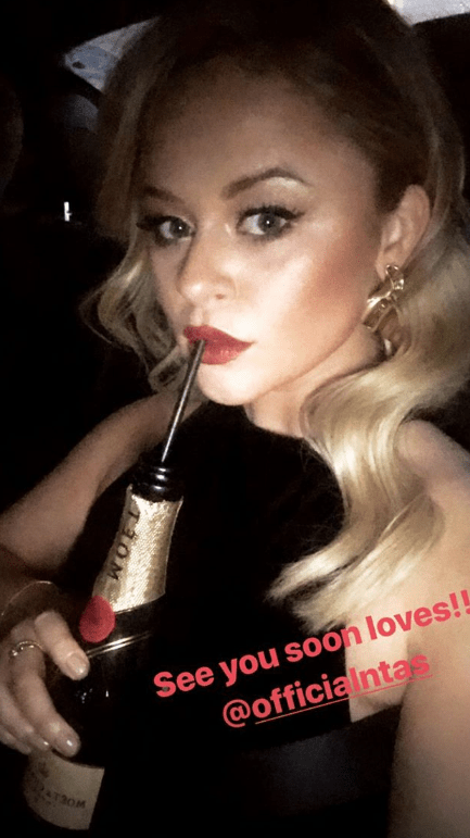 Emily Atack drunk champagne through a straw on the way to the show