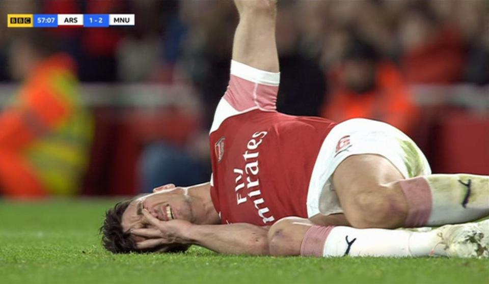  Koscielny appeared in a lot of pain as he lay on the grass