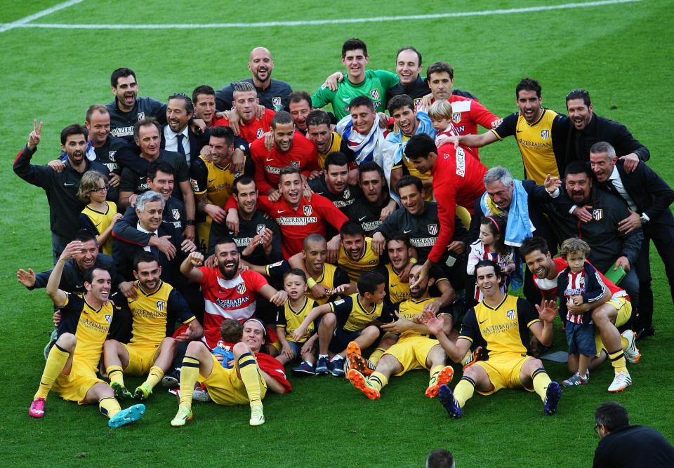  Godin (bottom left) led Atletico to La Liga in 2014 - their first for 18 seasons