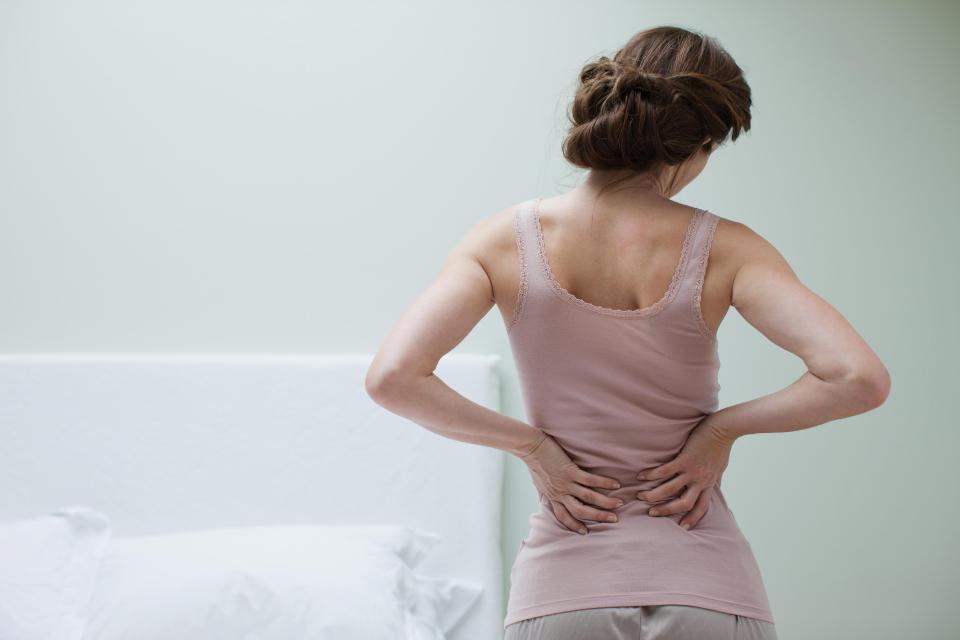  Lower back ache could be a sign of sitting oddly at your desk, but it could also be caused by pressure from cancer growing