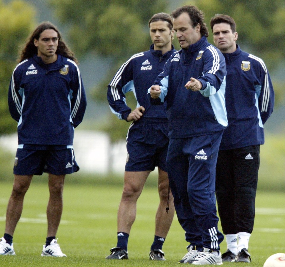 Pochettino, second-left, listens in intently as Bielsa gives instruction while in charge of Argentina