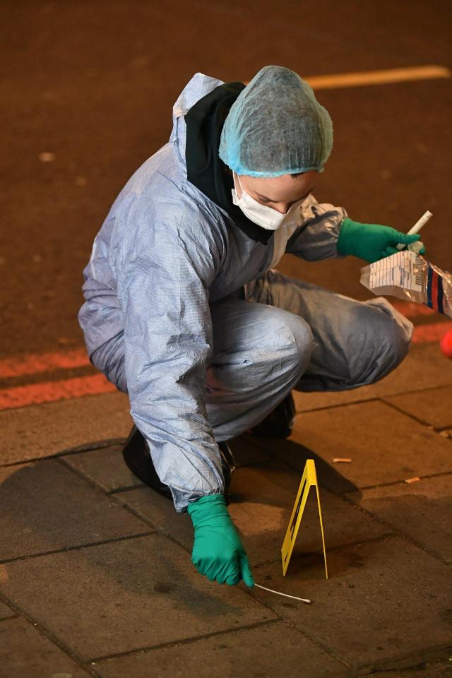  Forensics officers work at the scene of the shocking attacking in Mayfair