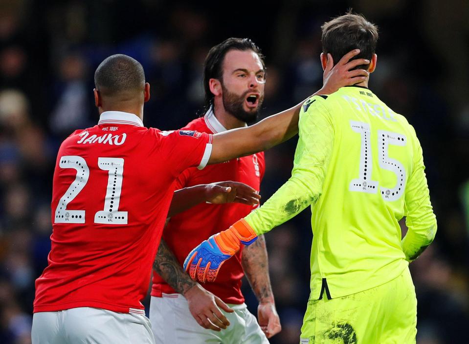  Forest team-mates congratulate Luke Steele for saving the penalty