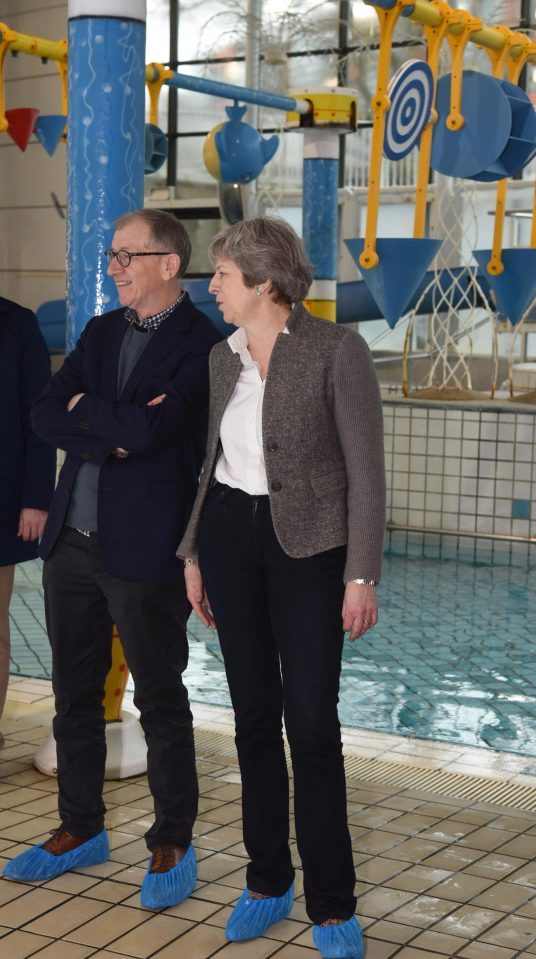  Theresa and Philip May join locals at a swimming gala in her constituency