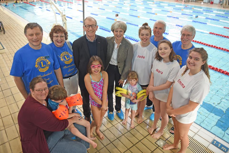  Theresa May poses with swimmers back in 2018 and has worn the same outfit three years running